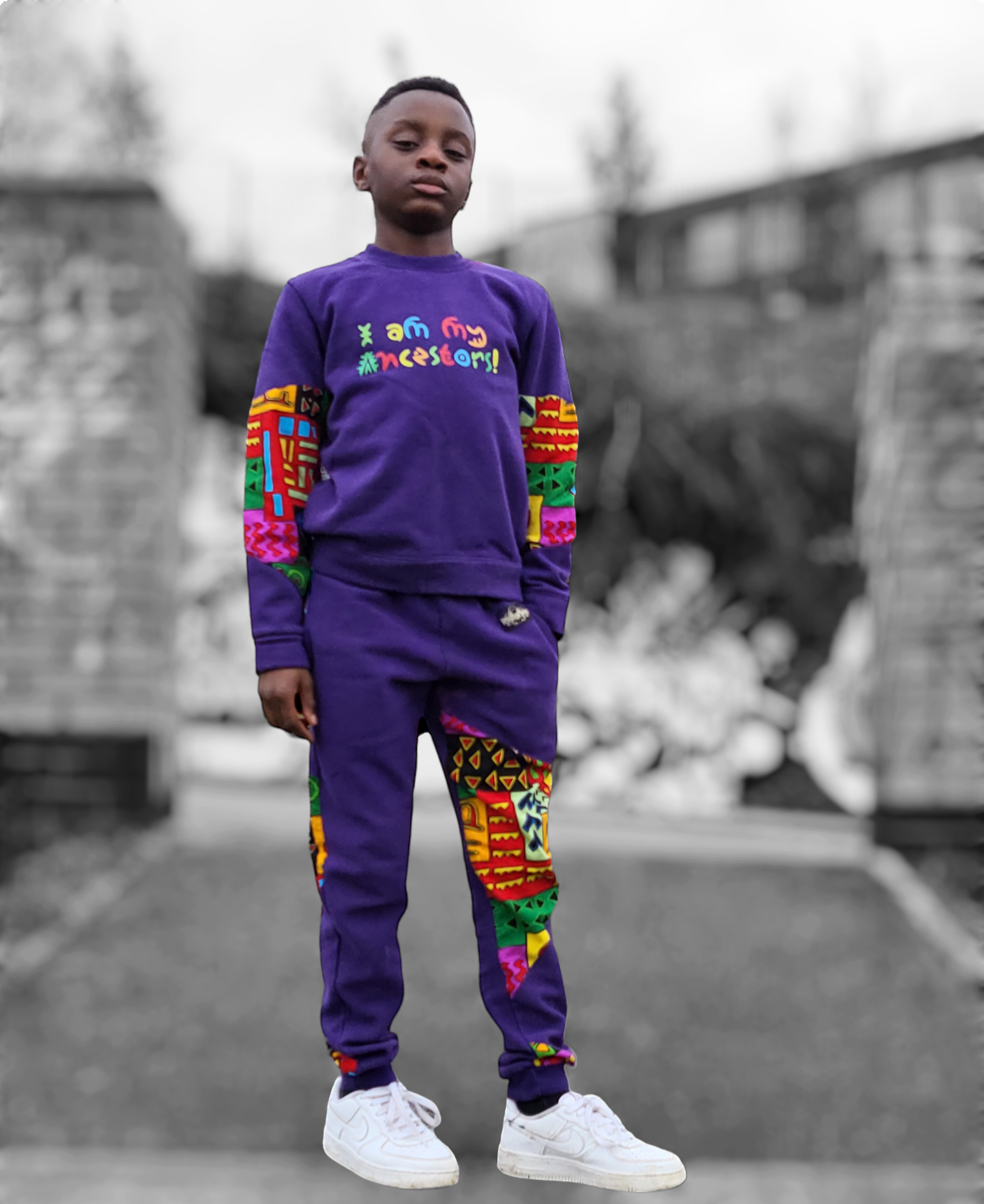 I am my ancestors tracksuit. Made with purple 100% cotton sweatshirt jersey with accents of 100% Ankara print cotton. 
